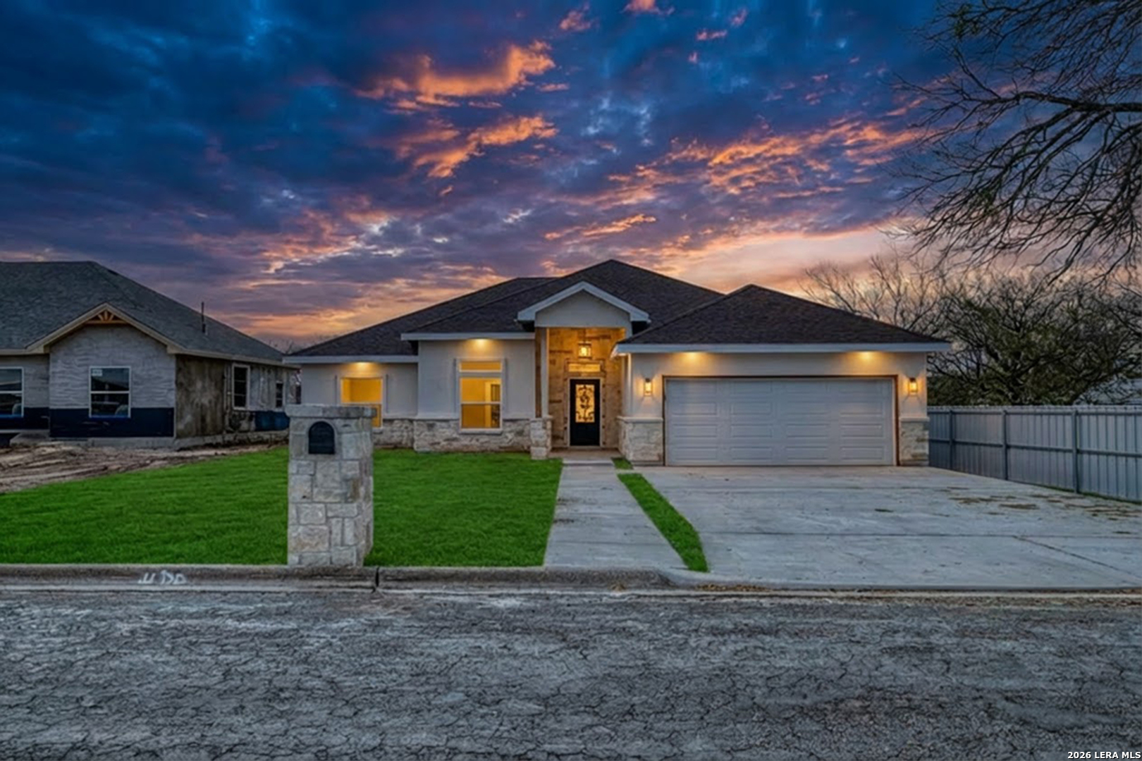 207 Riverside Drive Uvalde, TX 78801 - Photo 3 of 37 a front view of a house with a yard and garage