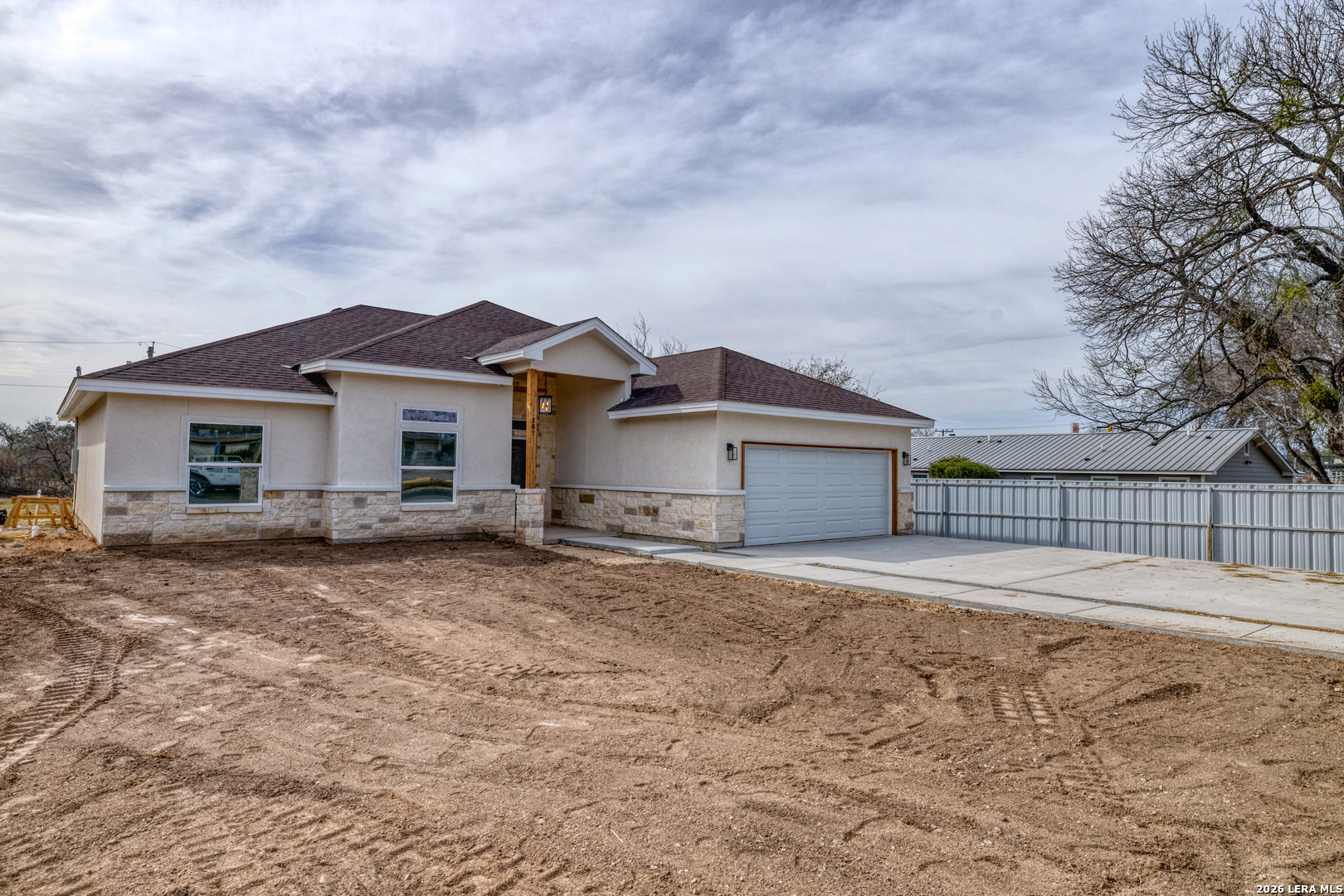 207 Riverside Drive Uvalde, TX 78801 - Photo 4 of 37 a view of a house with a yard and large tree