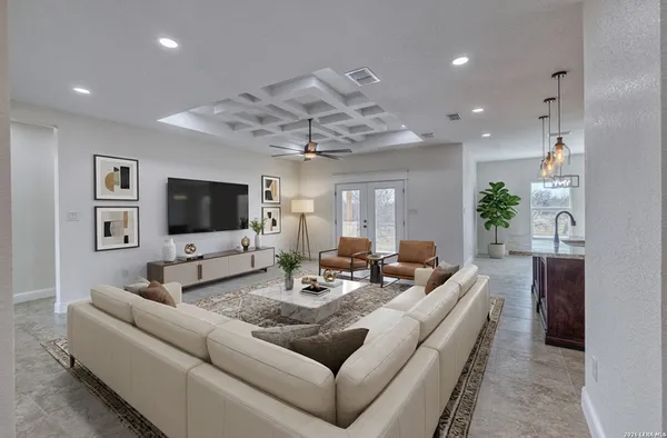 a living room with furniture and a flat screen tv