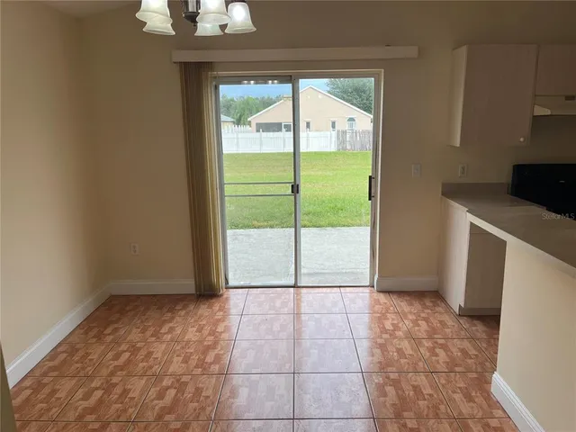 a view of a kitchen with a sink and a window