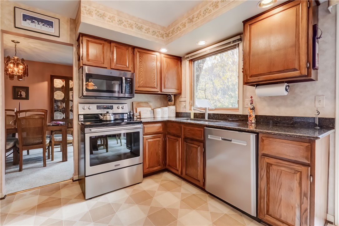 22 Pennicott Circle Penfield, NY 14526 - Photo 17 of 44 Direct access from the kitchen to the dining room.