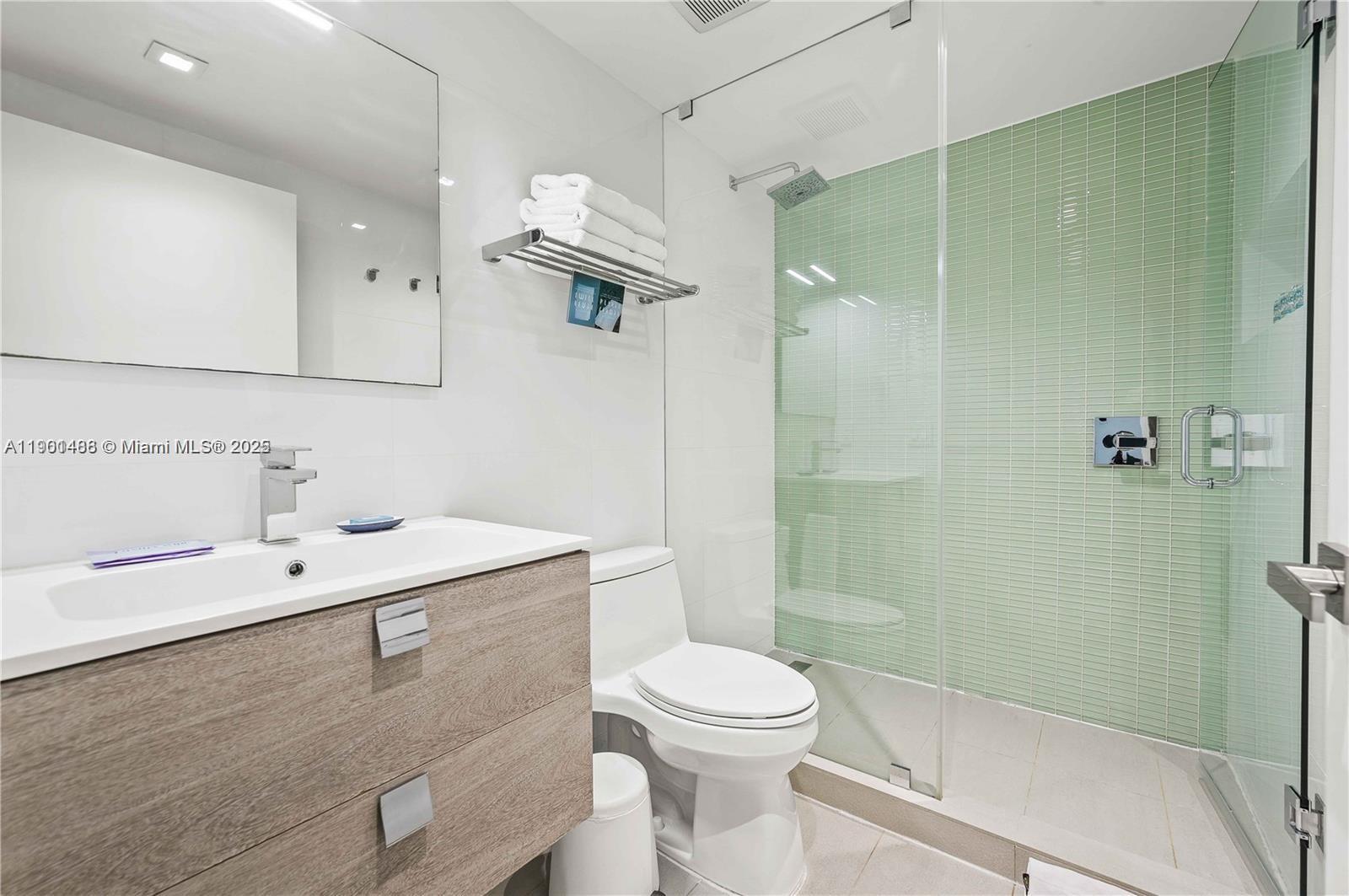 1215 West Avenue, Unit 605 Miami Beach, FL 33139 - Photo 12 of 19 a bathroom with a sink a toilet and shower