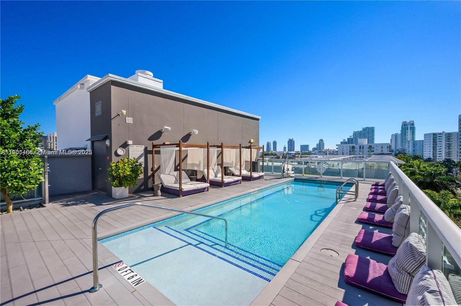 1215 West Avenue, Unit 605 Miami Beach, FL 33139 - Photo 15 of 19 a view of a balcony with chairs and potted plants
