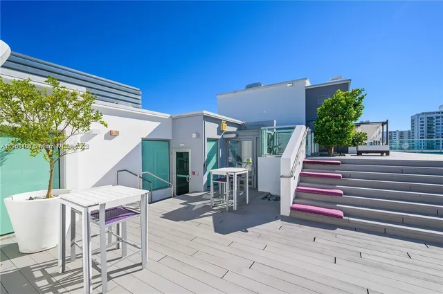 a view of a tables and chairs in patio