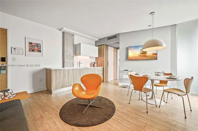 a room with furniture and wooden floor