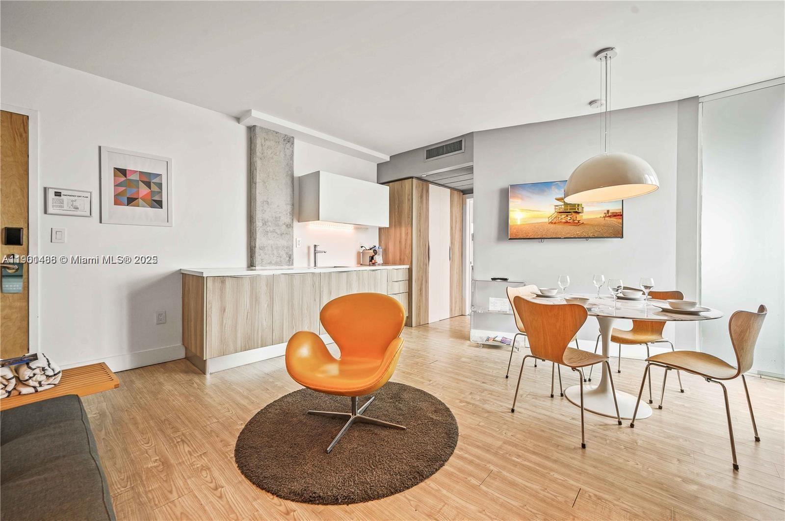 1215 West Avenue, Unit 605 Miami Beach, FL 33139 - Photo 4 of 19 a room with furniture and wooden floor