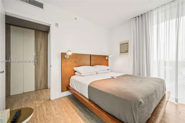 a bedroom with a bed and a cabinets