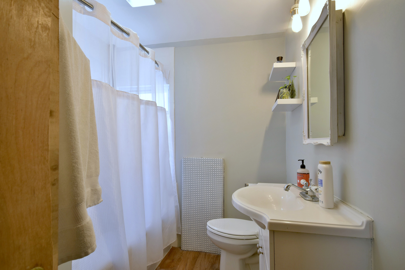 7625 Monroe Street Forest Park, IL 60130 - Photo 18 of 52 a bathroom with a sink toilet and a mirror