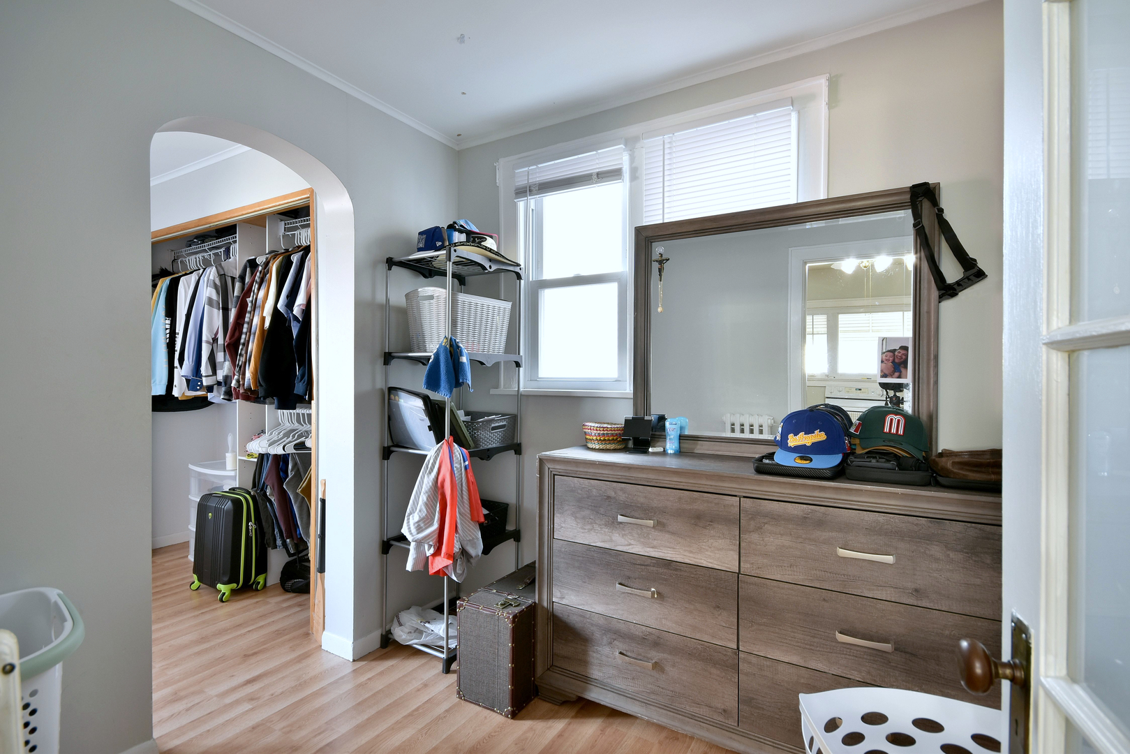 7625 Monroe Street Forest Park, IL 60130 - Photo 23 of 52 a view of walk in closet with clothes and shoes