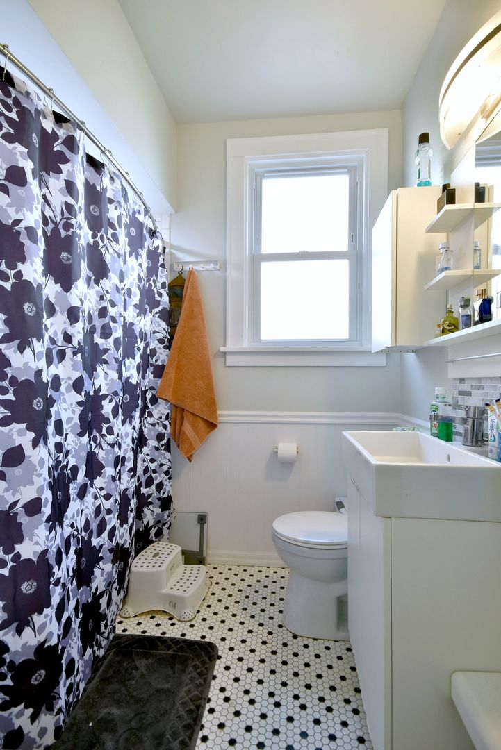 7625 Monroe Street Forest Park, IL 60130 - Photo 31 of 52 a bathroom with a sink toilet and window