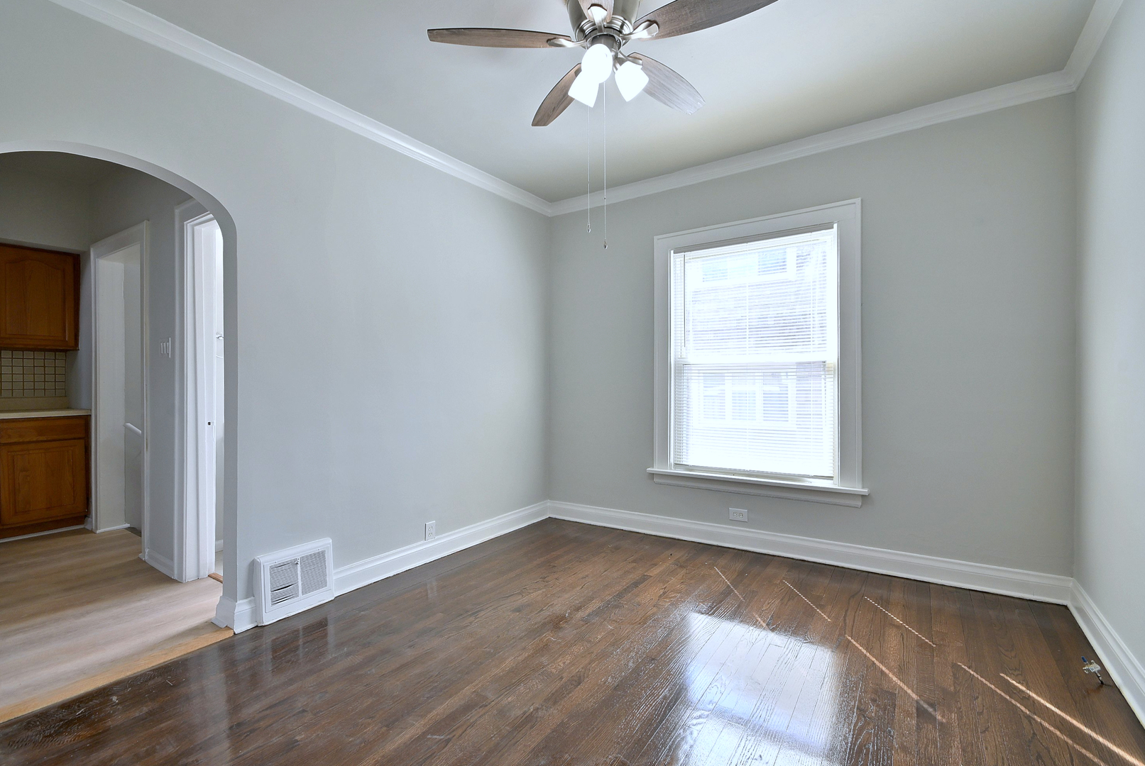 7625 Monroe Street Forest Park, IL 60130 - Photo 33 of 52 a view of an empty room with wooden floor and a window