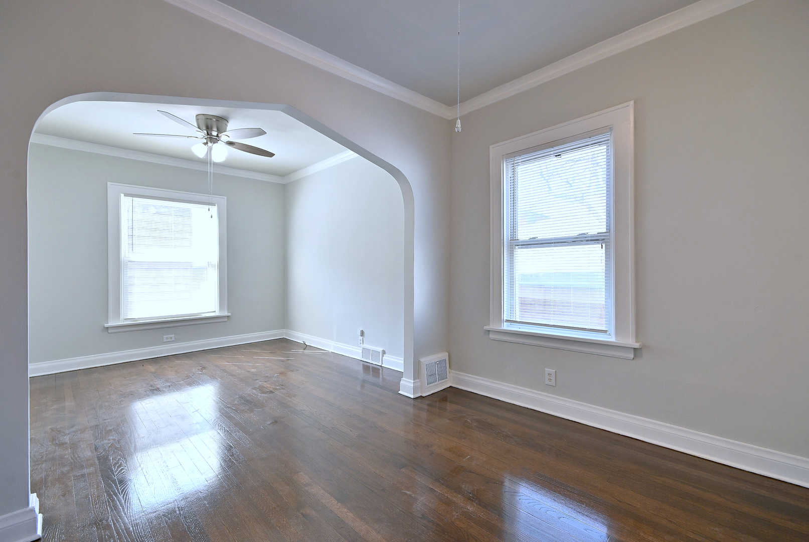 7625 Monroe Street Forest Park, IL 60130 - Photo 35 of 52 an empty room with wooden floor windows and fan