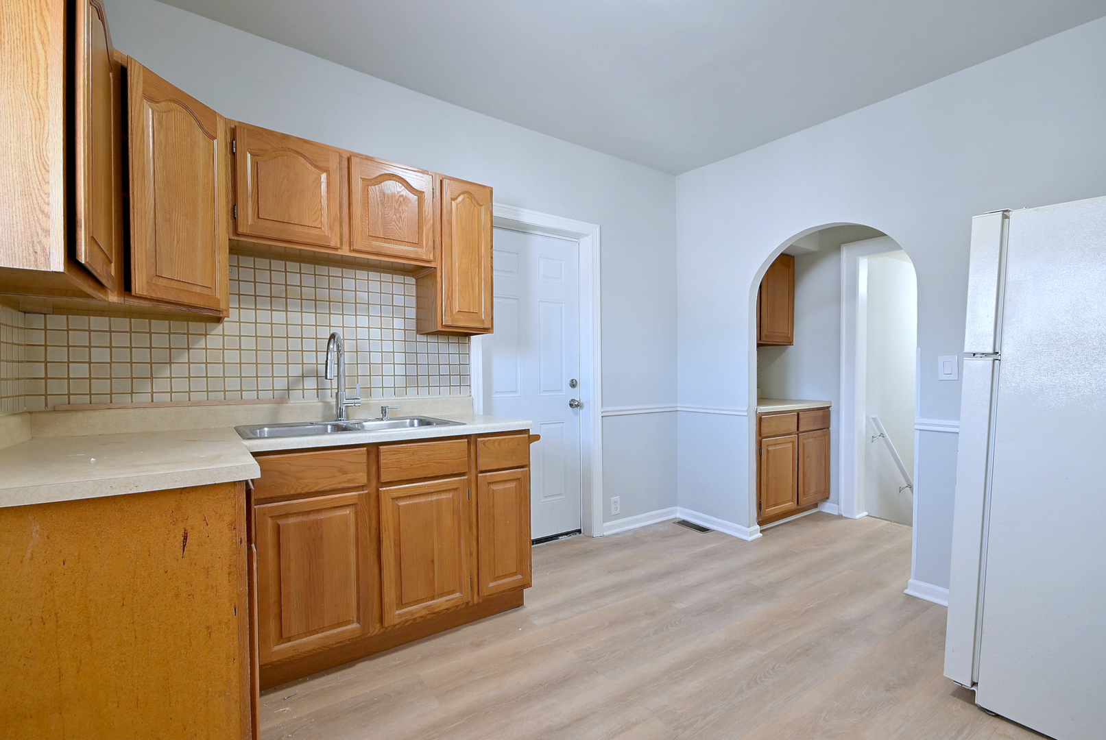 7625 Monroe Street Forest Park, IL 60130 - Photo 38 of 52 a kitchen with stainless steel appliances granite countertop a sink a stove and a refrigerator