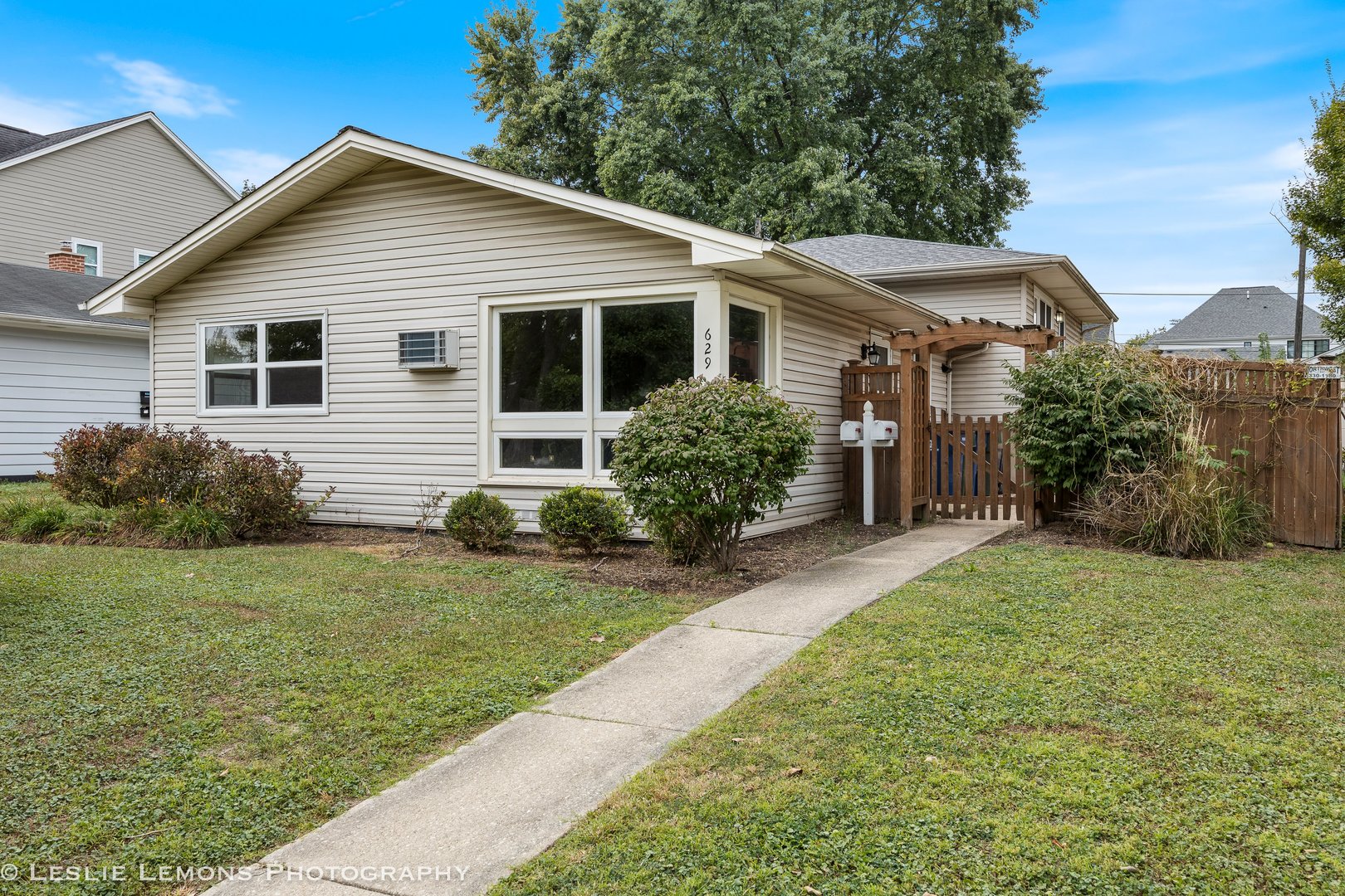 629 South Main Street, Unit BACK Naperville, IL 60540 - Photo 1 of 29 a front view of house with yard and green space