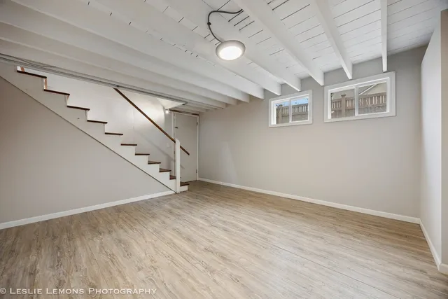 a view of an entryway with wooden floor