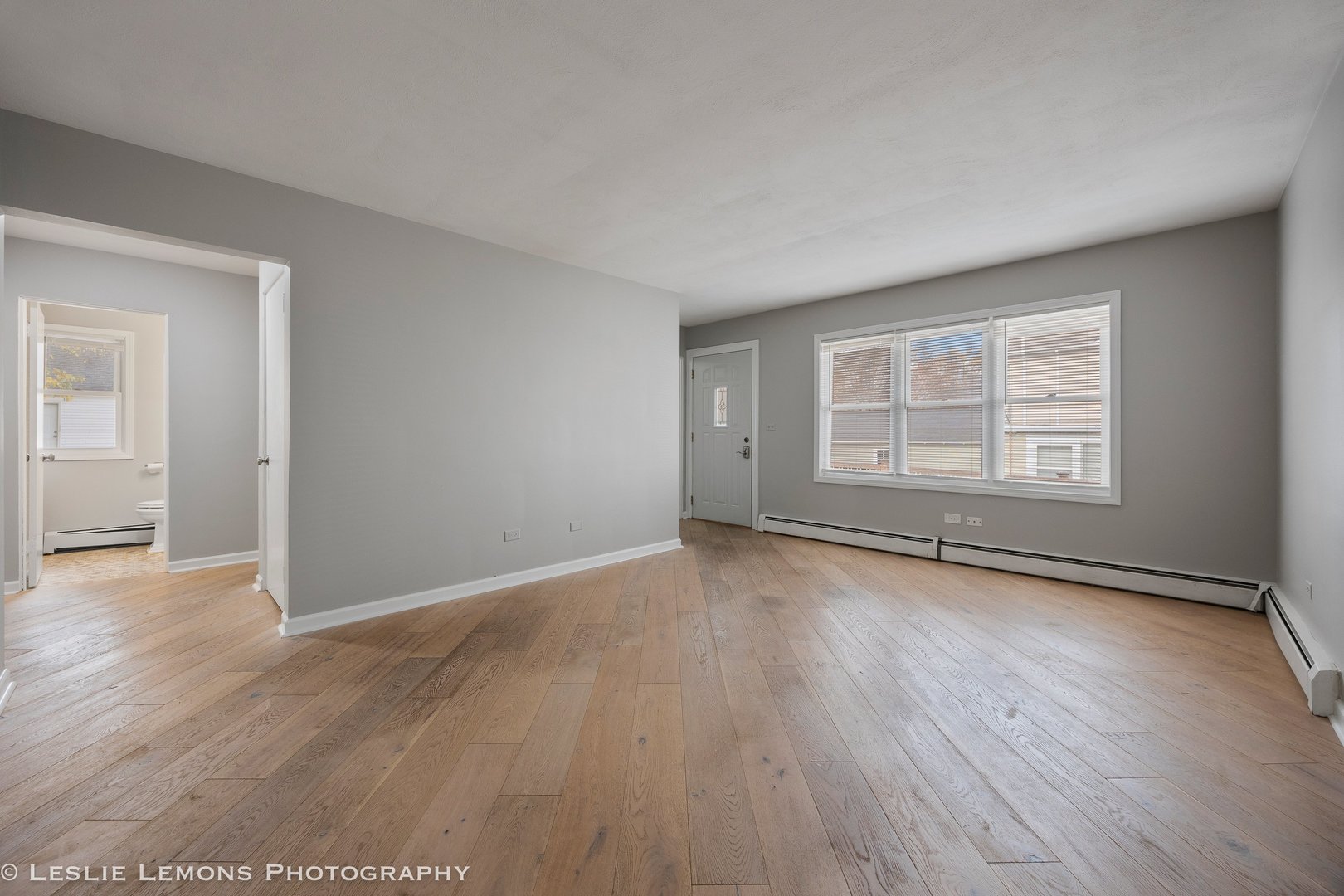 629 South Main Street, Unit BACK Naperville, IL 60540 - Photo 4 of 29 an empty room with wooden floor and windows