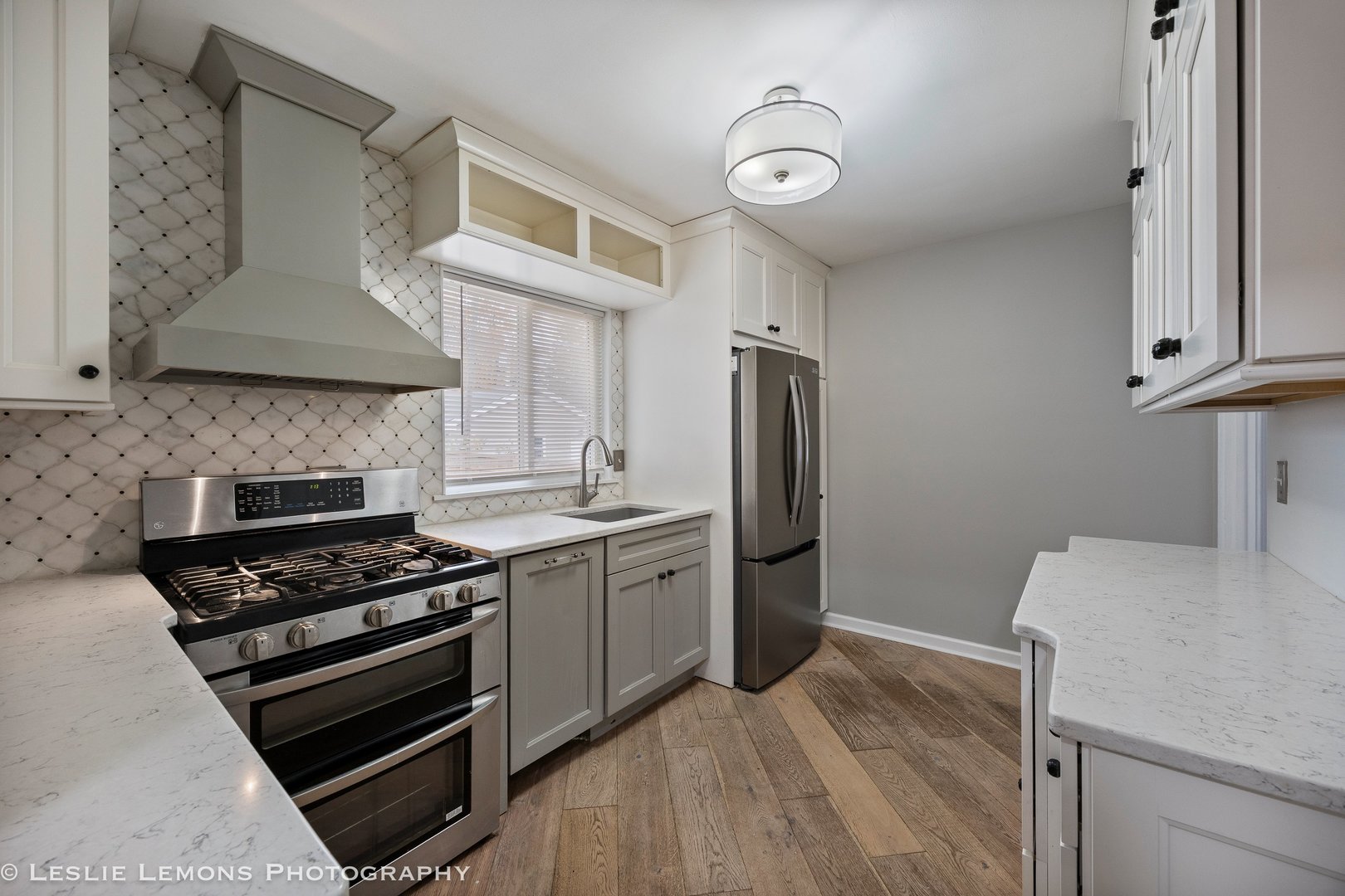 629 South Main Street, Unit BACK Naperville, IL 60540 - Photo 6 of 29 a kitchen with stainless steel appliances a stove a sink and a refrigerator