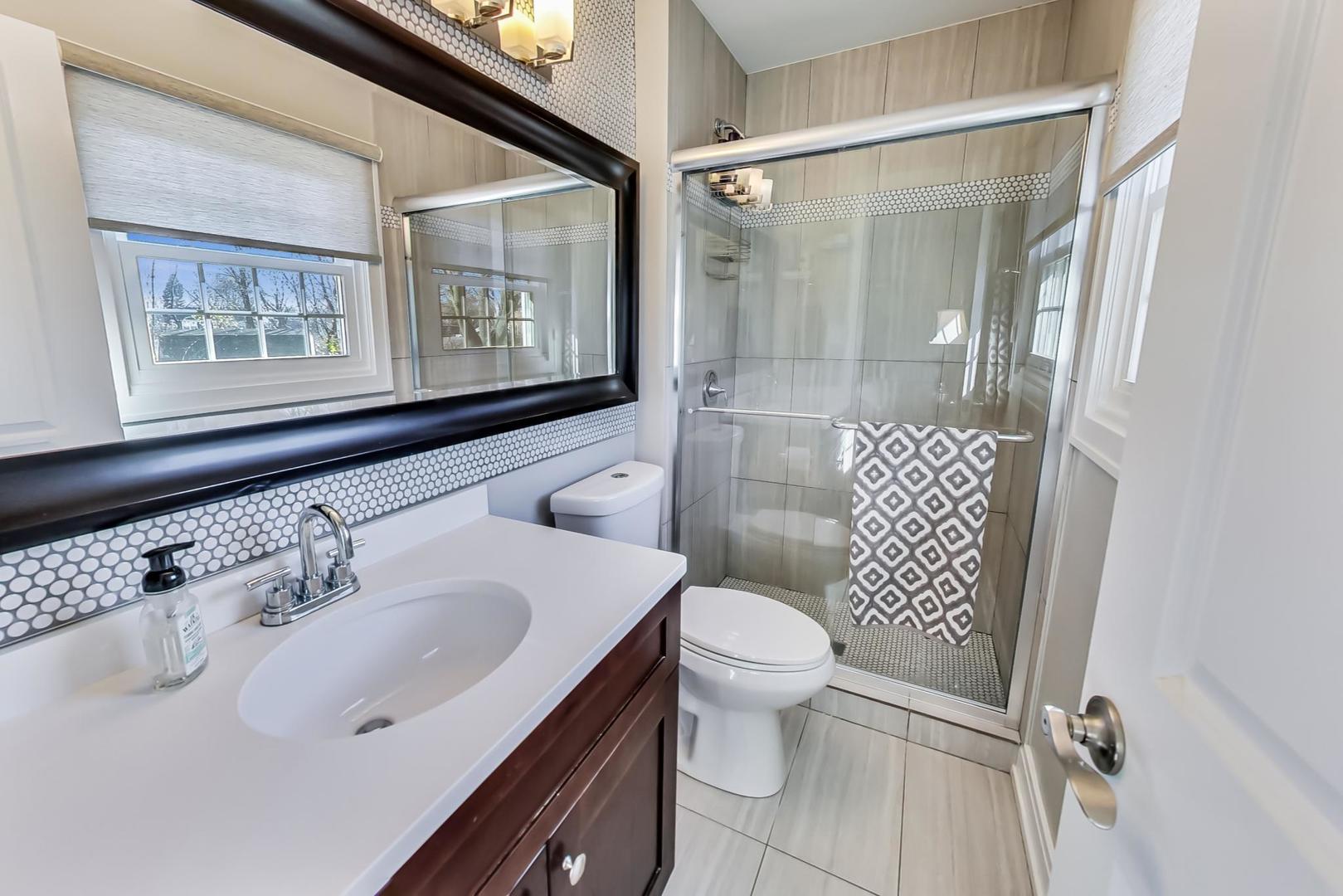 34 Timber Hill Road Buffalo Grove, IL 60089 - Photo 13 of 37 a bathroom with a sink toilet and shower