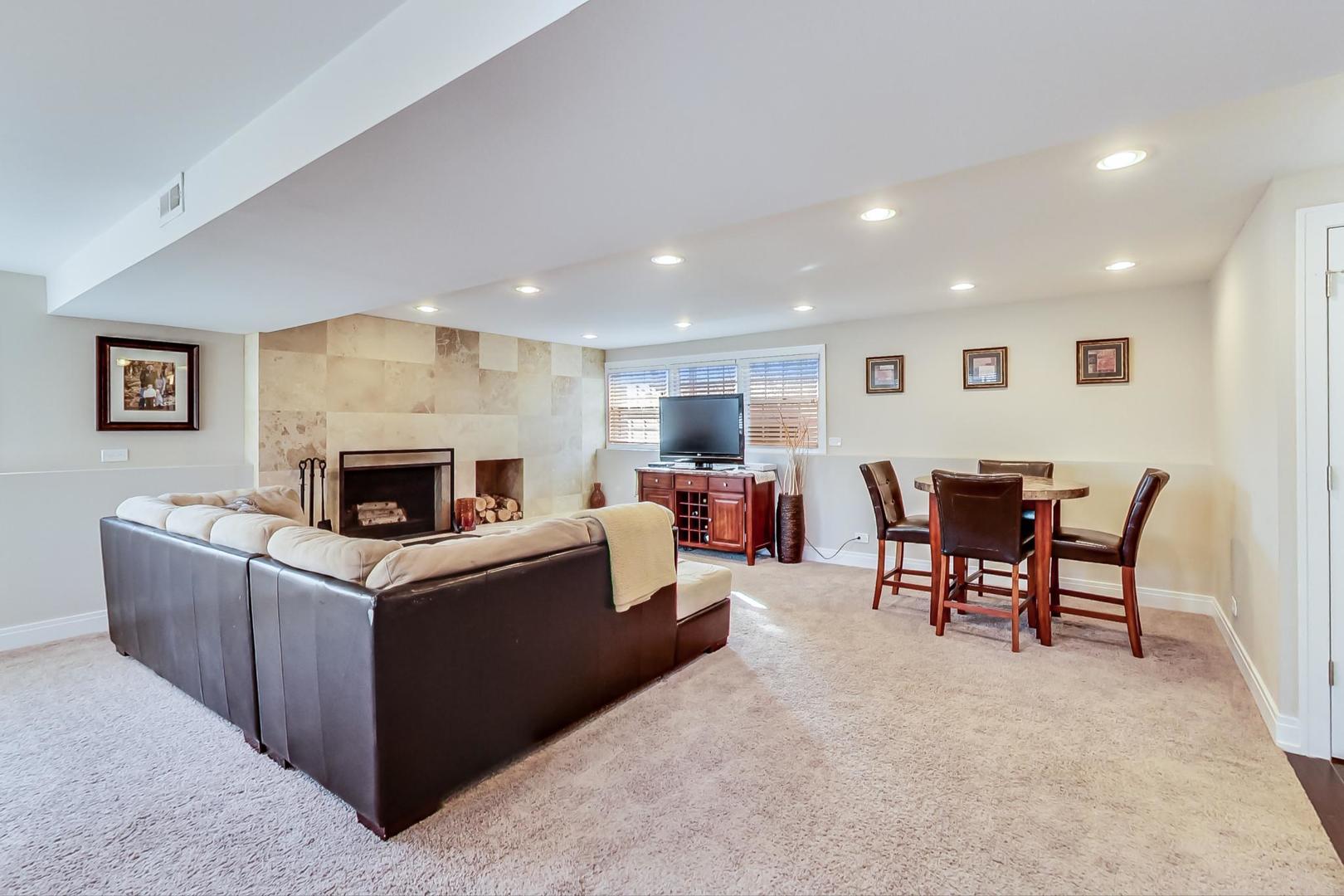 34 Timber Hill Road Buffalo Grove, IL 60089 - Photo 16 of 37 a living room with furniture and a fireplace