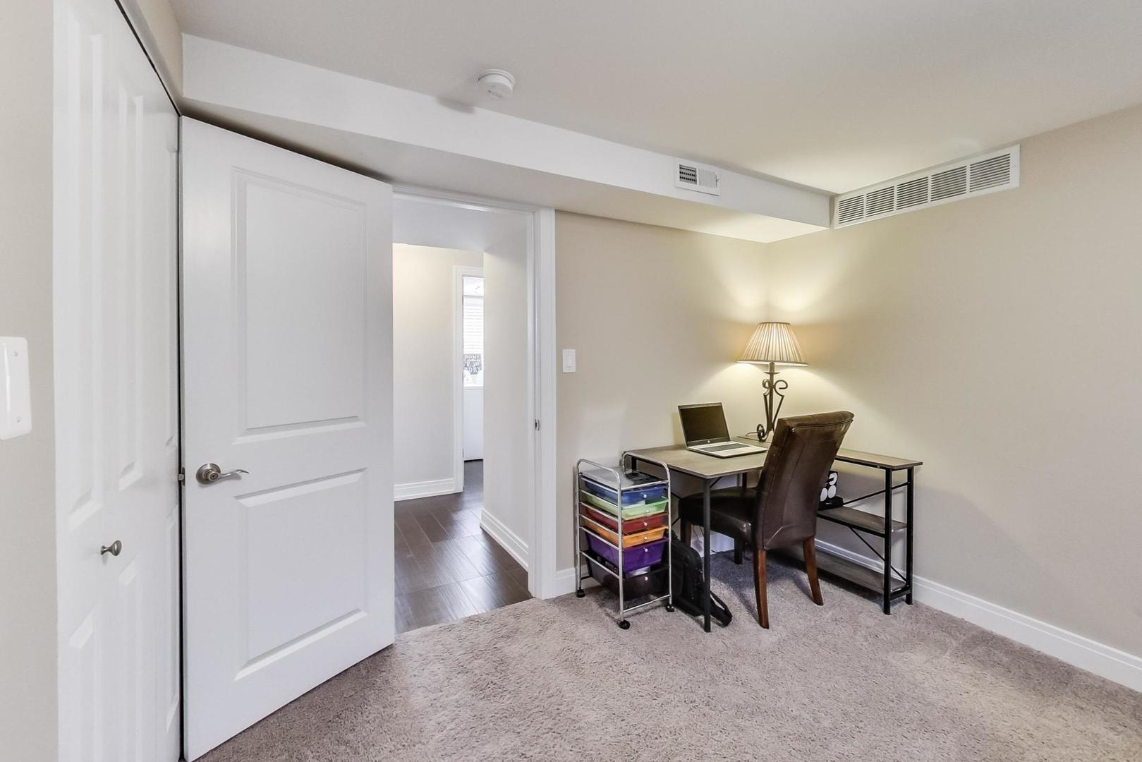 34 Timber Hill Road Buffalo Grove, IL 60089 - Photo 22 of 37 a view of a workspace with furniture and a window