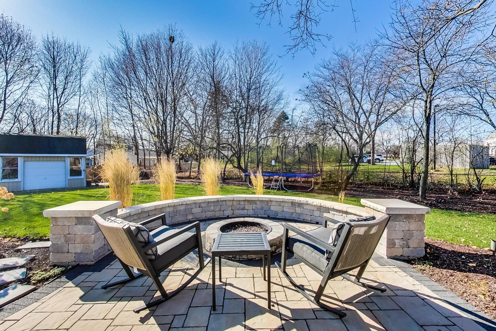 34 Timber Hill Road Buffalo Grove, IL 60089 - Photo 28 of 37 a view of a swimming pool with chairs in a patio