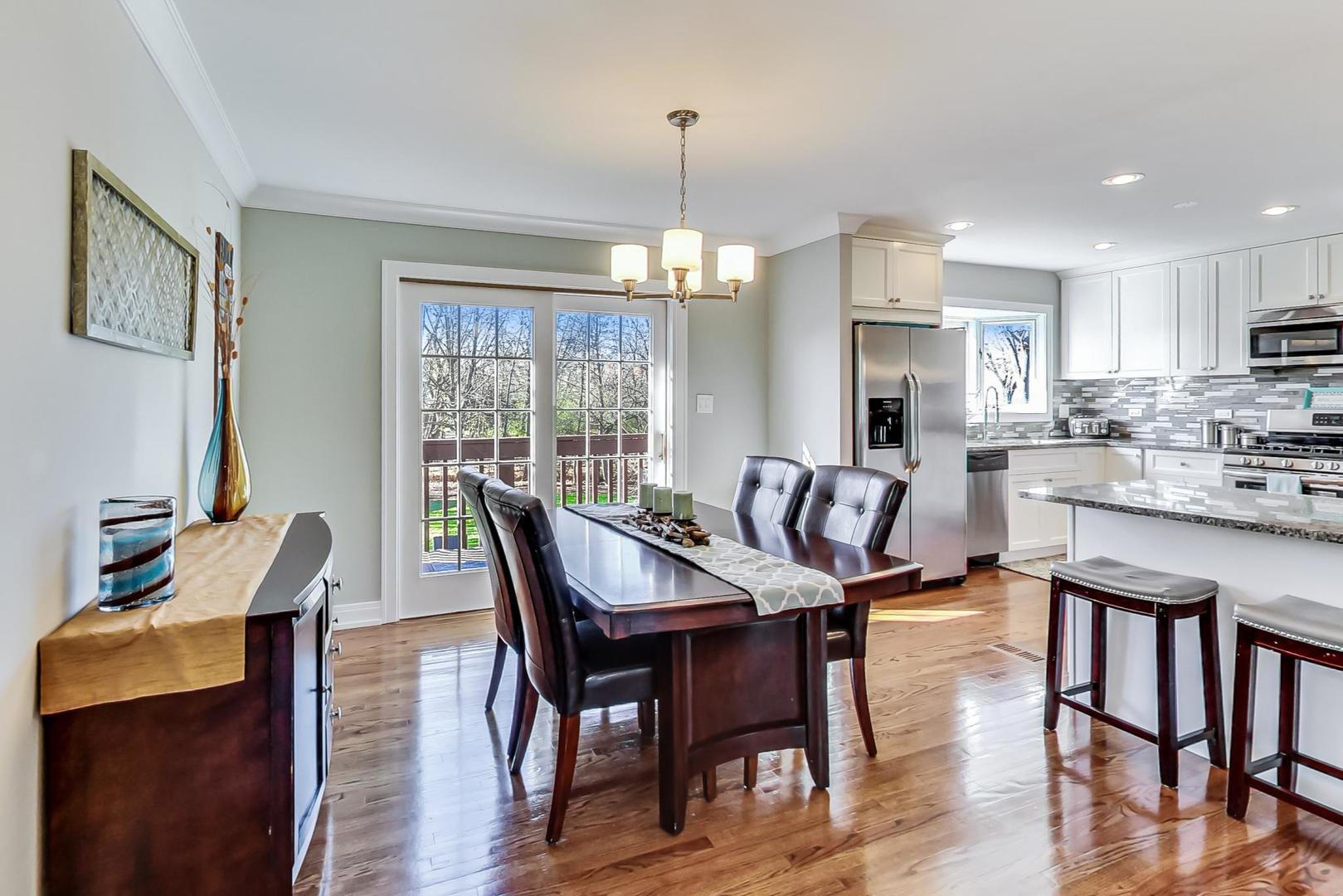 34 Timber Hill Road Buffalo Grove, IL 60089 - Photo 6 of 37 a view of a dining room with furniture window and wooden floor