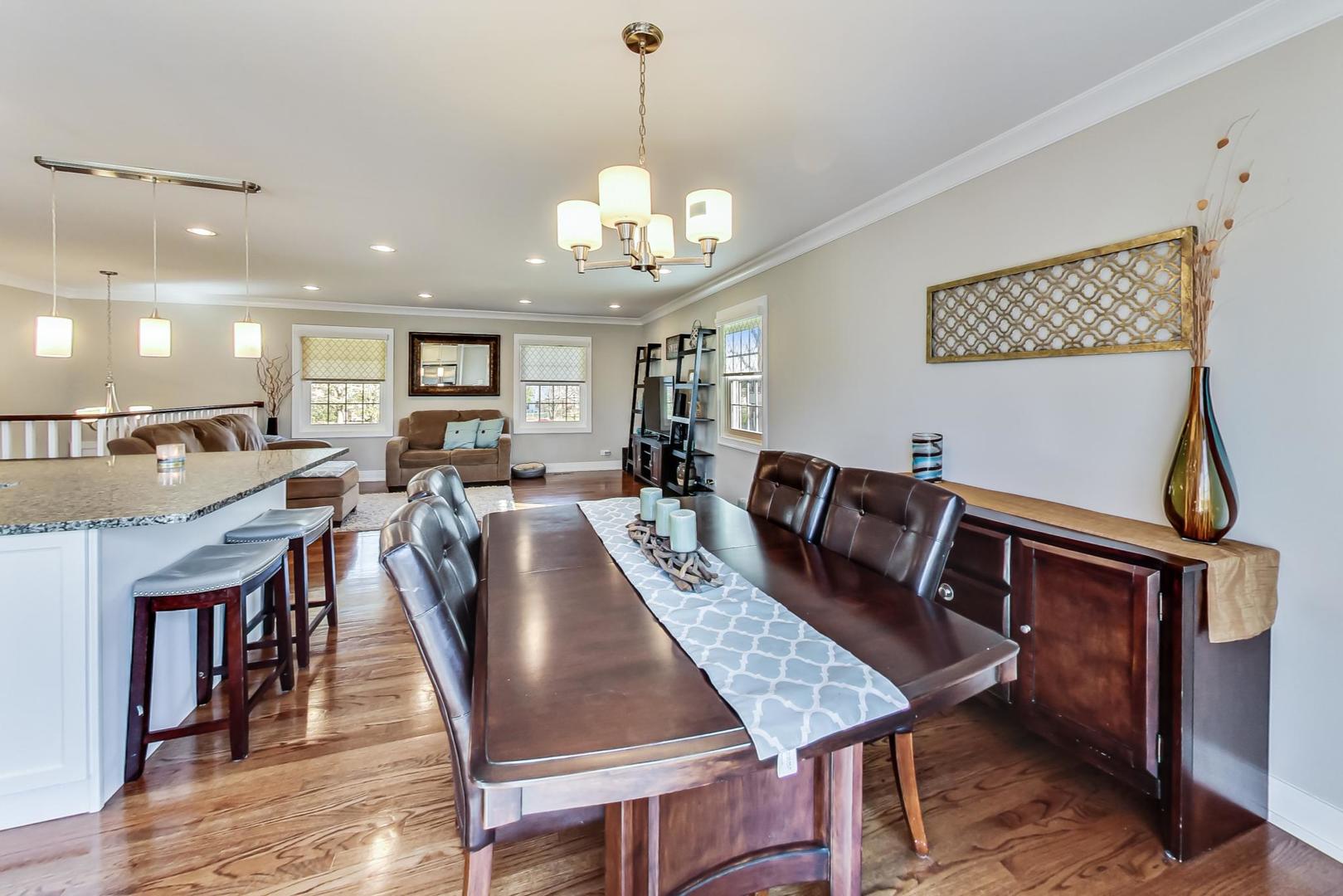 34 Timber Hill Road Buffalo Grove, IL 60089 - Photo 7 of 37 a view of a dining room with furniture and wooden floor