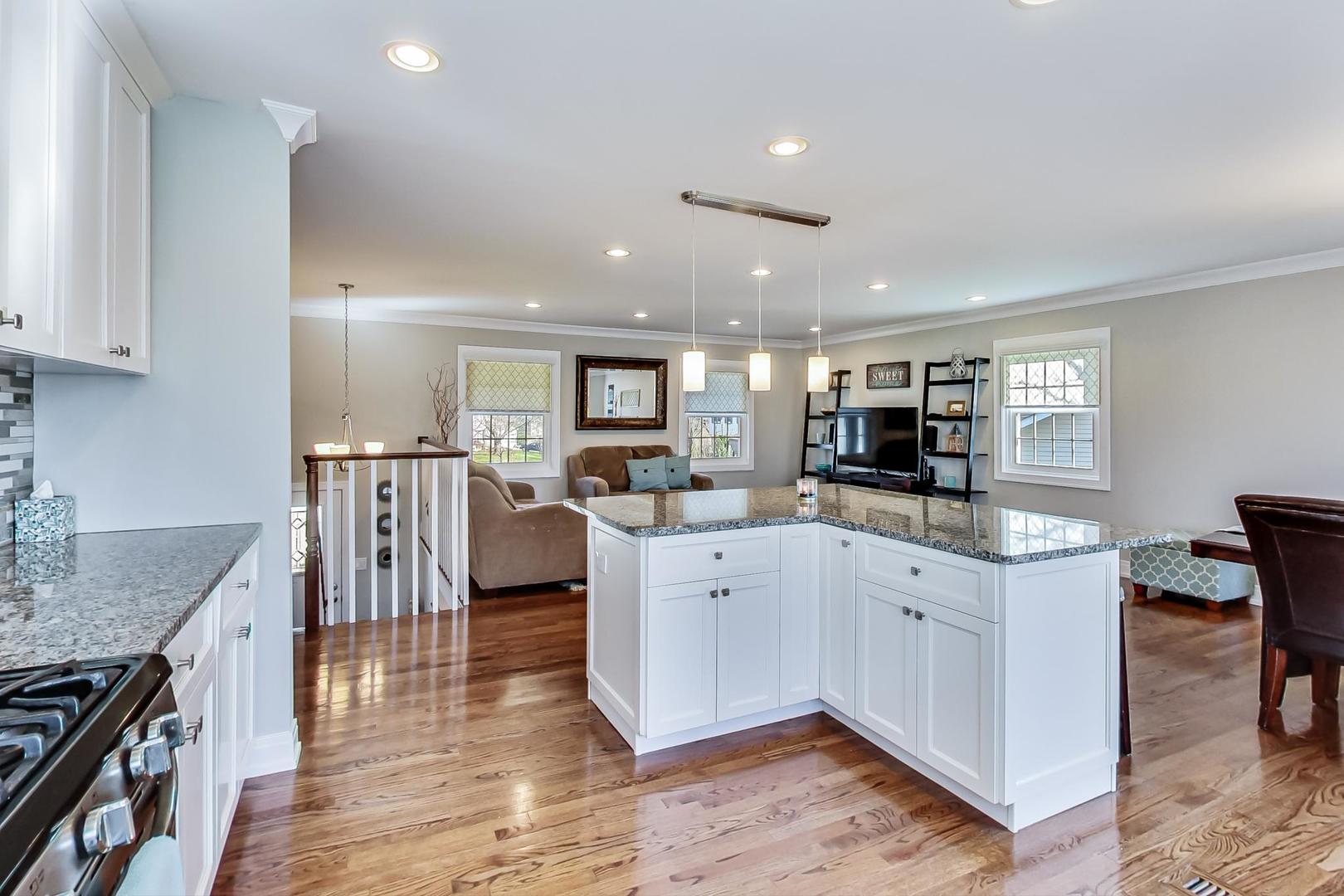 34 Timber Hill Road Buffalo Grove, IL 60089 - Photo 10 of 37 a kitchen with cabinets and wooden floor