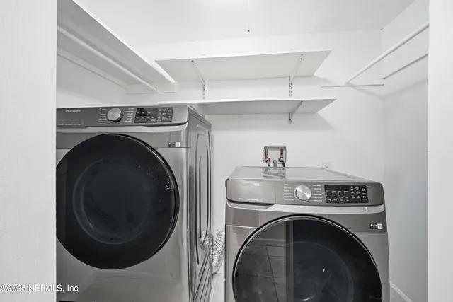 a utility room with dryer and washer