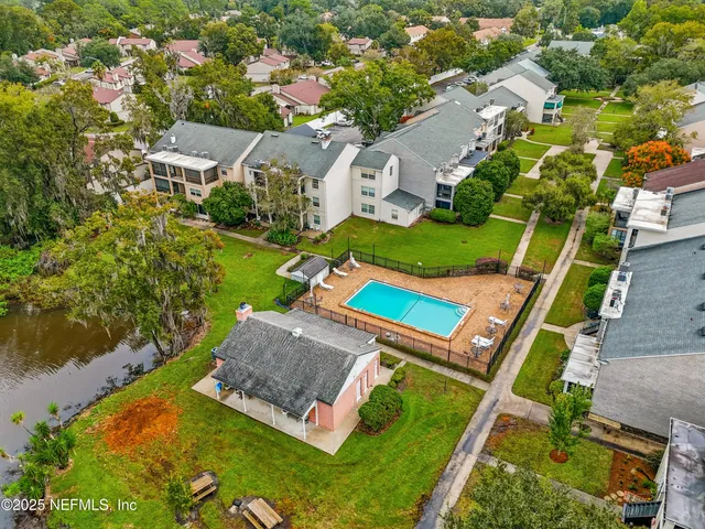 an aerial view of a house with a garden