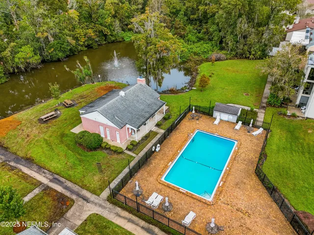 an aerial view of a house with a lake view