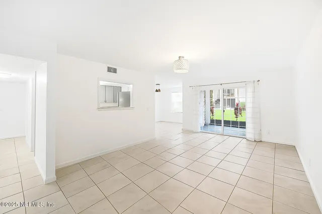 a view of an empty room and window