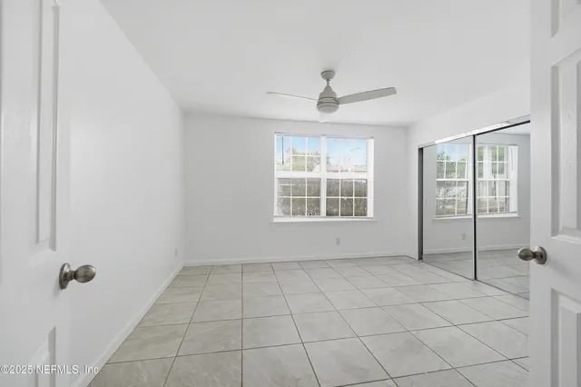 a view of an empty room with glass door