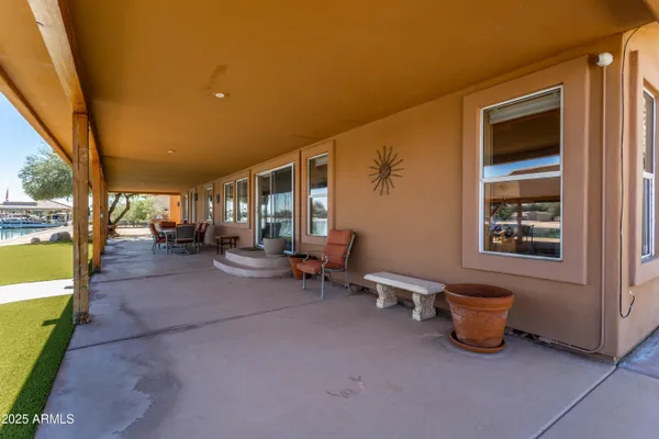 a view of a patio with table and chairs