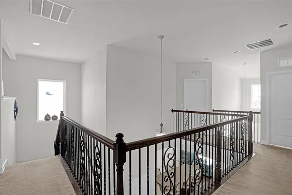 a view of a hallway with windows