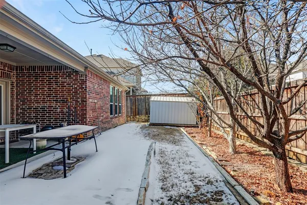 a view of a backyard with sitting area