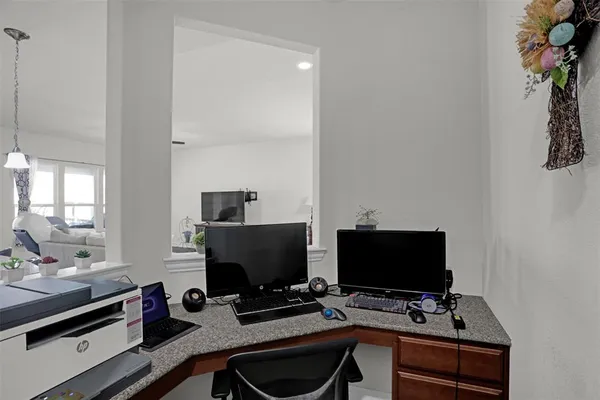 a desktop computer sitting on top of a desk with wooden floor