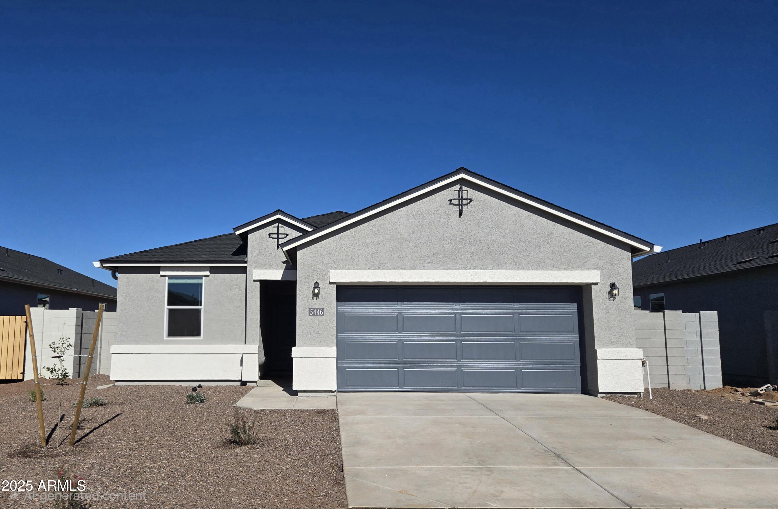 a front view of a house with garage