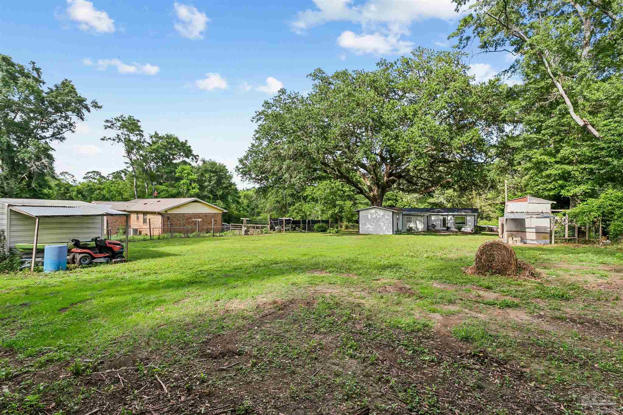 1095 River Annex Road Cantonment, FL 32533 - Photo 32 of 32 a view of a house with a yard