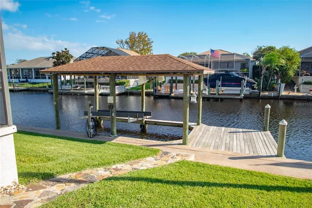 a front view of house with yard and outdoor seating