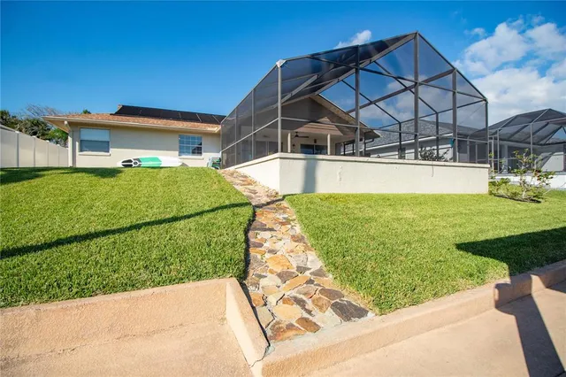 a view of a back yard of the house