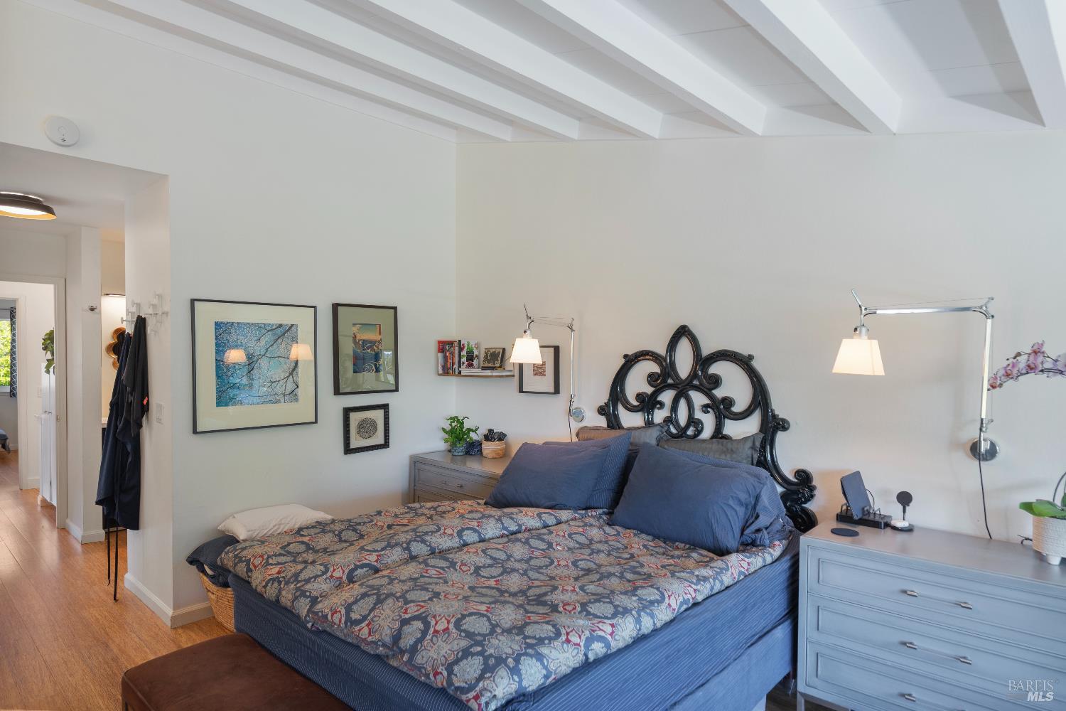 9 Porto Bello Drive San Rafael, CA 94901 - Photo 18 of 34 a bedroom with a bed and wooden floor