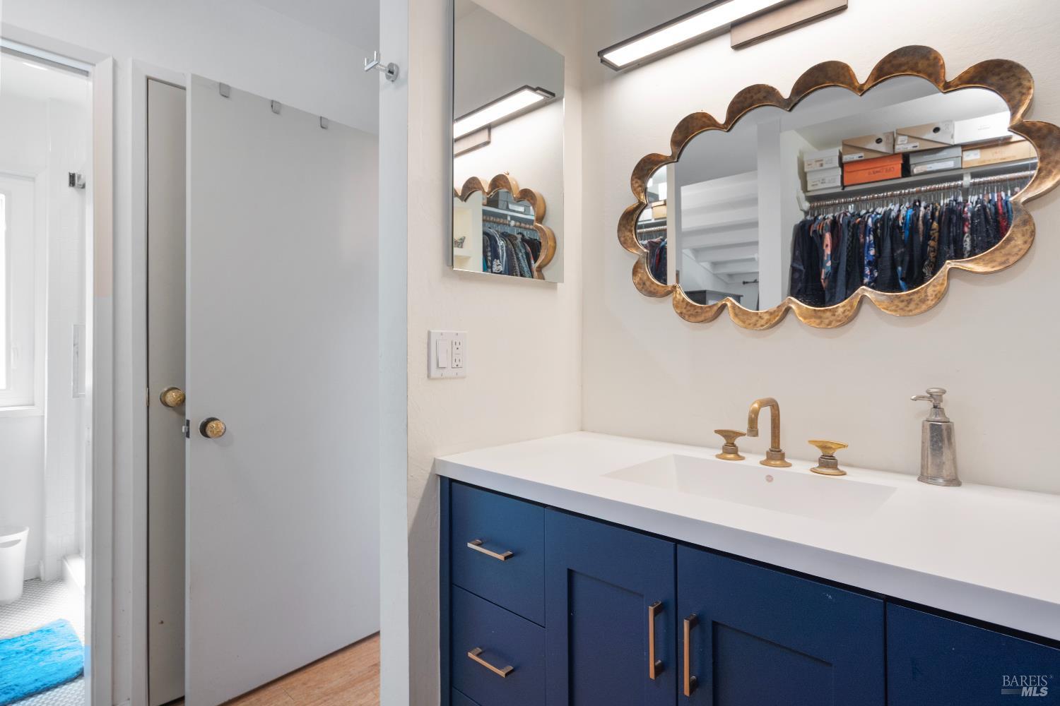 9 Porto Bello Drive San Rafael, CA 94901 - Photo 21 of 34 a bathroom with a sink and a mirror
