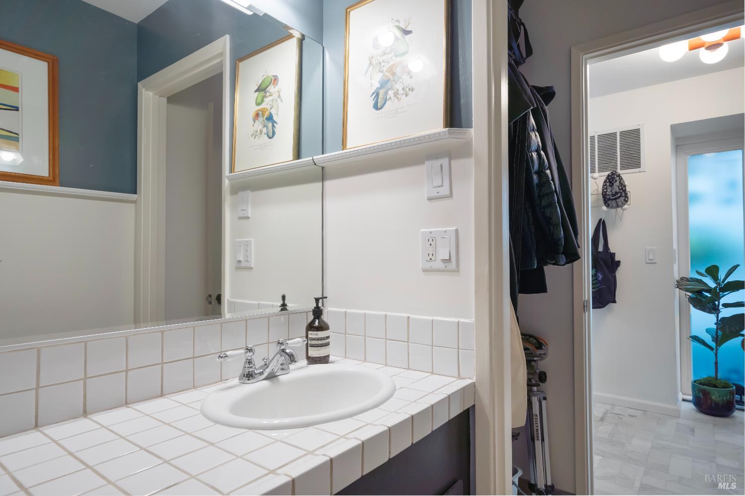 9 Porto Bello Drive San Rafael, CA 94901 - Photo 27 of 34 a bathroom with a sink and a mirror