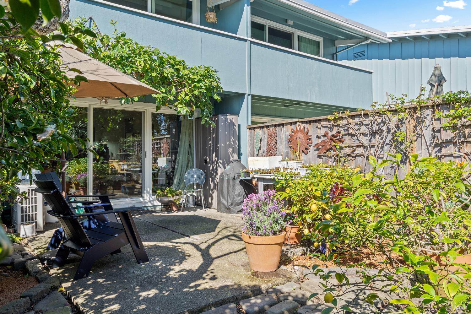 9 Porto Bello Drive San Rafael, CA 94901 - Photo 34 of 34 a patio with table and chairs and potted plants