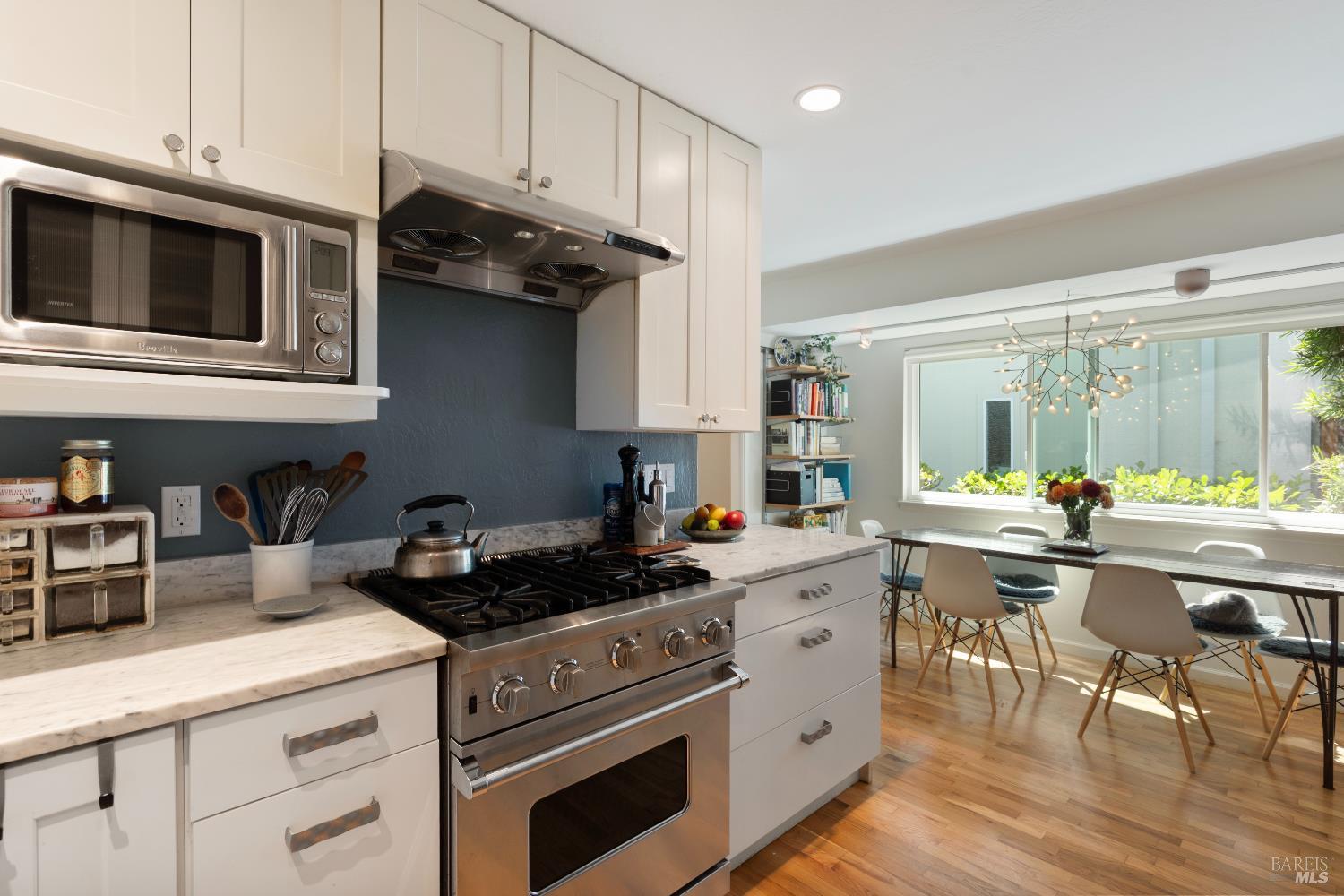 9 Porto Bello Drive San Rafael, CA 94901 - Photo 8 of 34 a kitchen with a sink a stove and cabinets