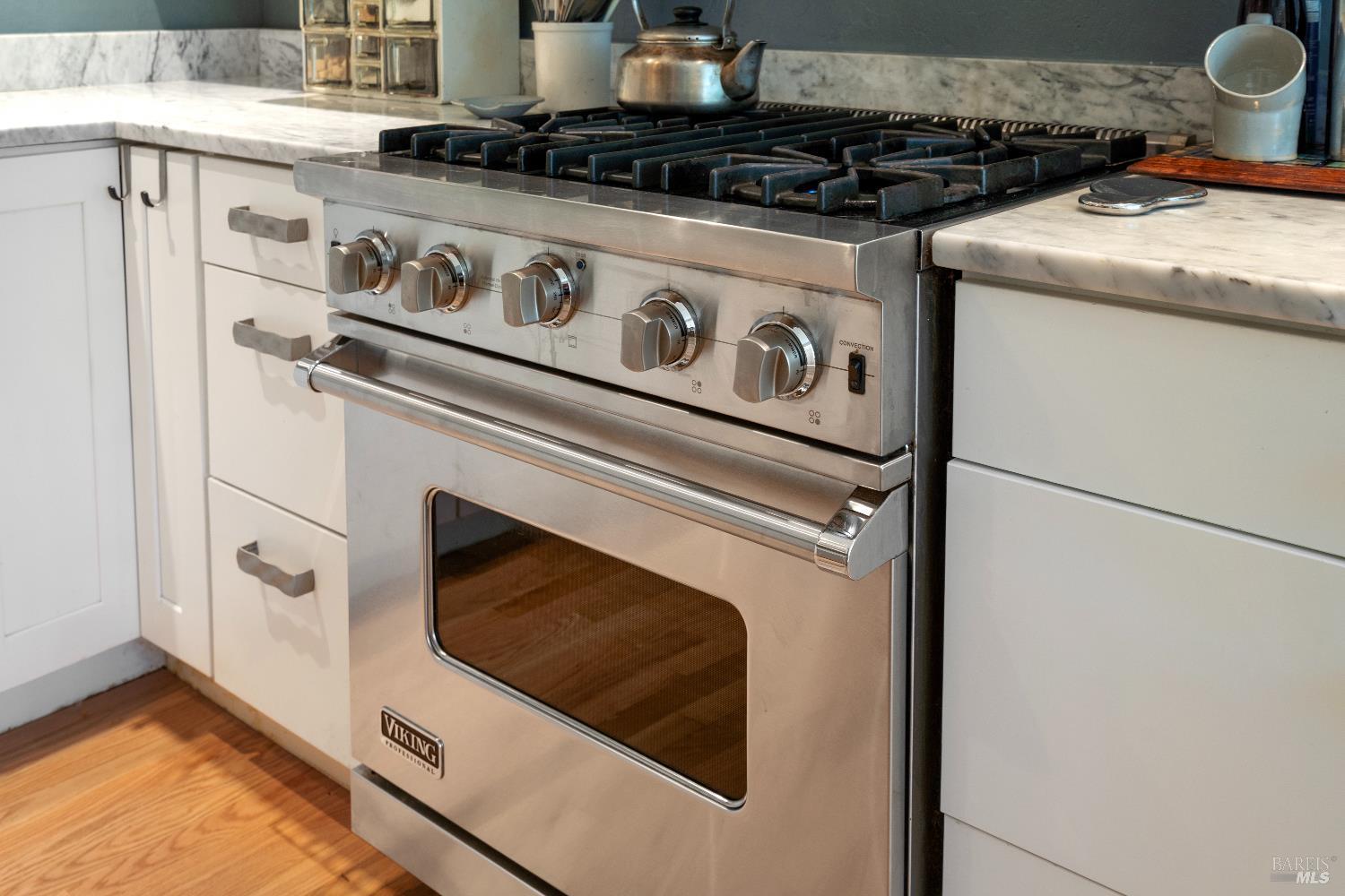 9 Porto Bello Drive San Rafael, CA 94901 - Photo 9 of 34 a stove top oven sitting inside of a kitchen