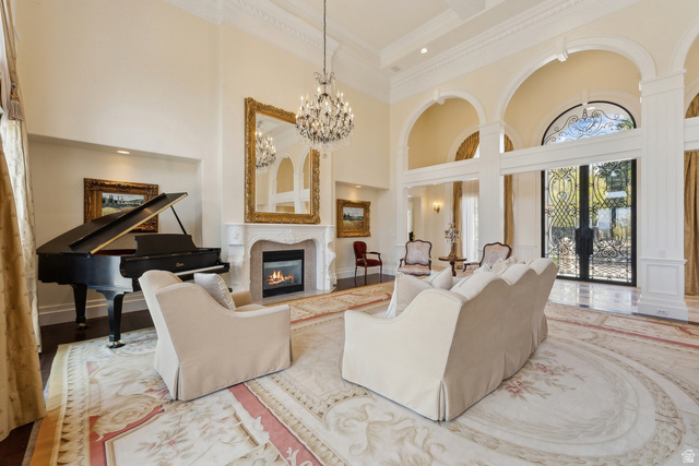 1714 Ridge Point Drive Bountiful, UT 84010 - Photo 24 of 132 Soaring ceilings with decorative crown molding, a decorative fireplace with a mantel, and arched doorways with custom ironwork