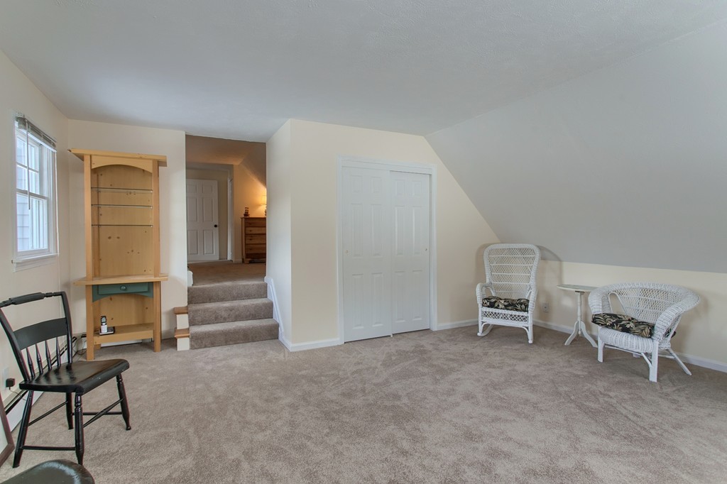 32 Shawnee Road Pepperell, MA 01463 - Photo 17 of 27 a view of a livingroom with furniture and staircase