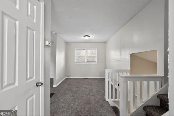 a view of livingroom with furniture and windows